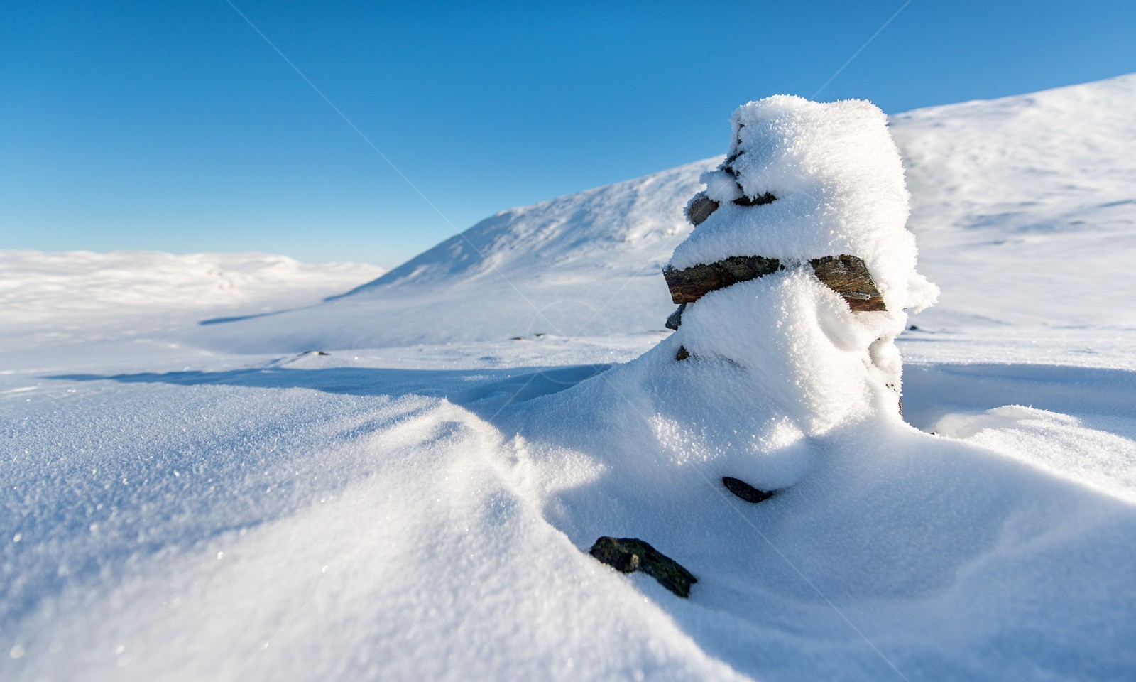Snow covered Cairn in Swedish Lapland
